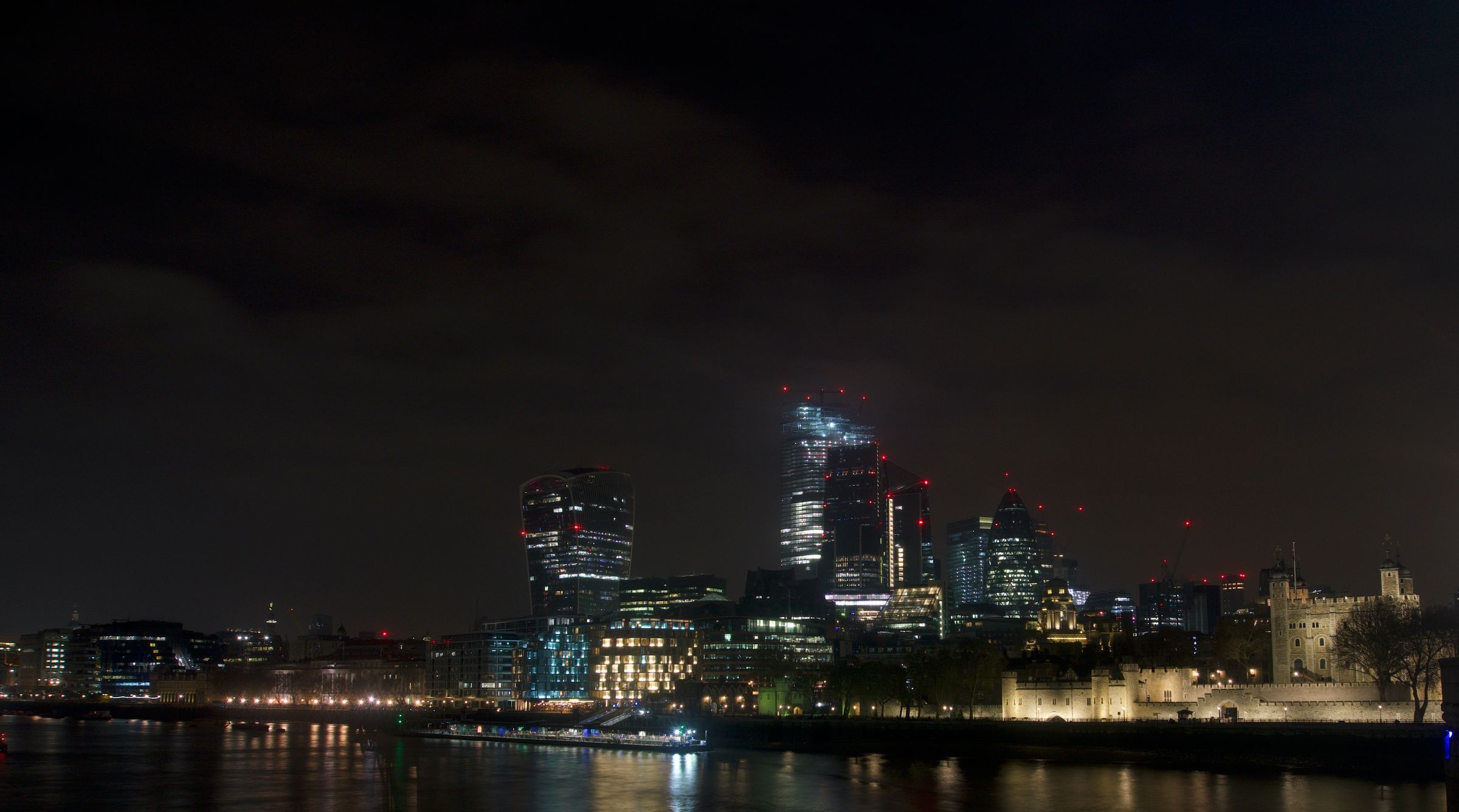 The London skyline at night under a dark sky
